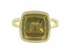 Natural yellow-green zircon cabochon in 18k green gold ring.