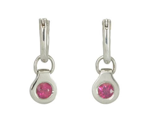 Round drops with rich pink gems in white gold frame. Drops hang on small U shaped hoops in solid white gold.