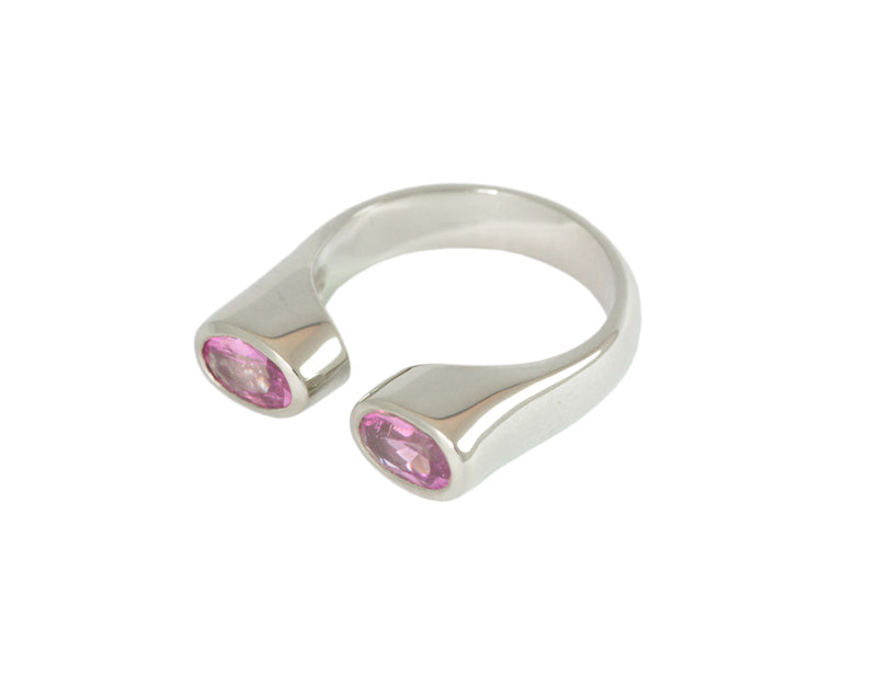 White gold ring with two pink oval sapphirs.