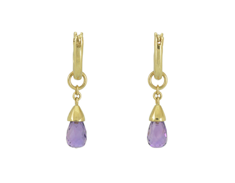 Pendulous drops with bright purple pear-shaped gems in yellow gold frame. Drops hang on small U shaped hoops in solid yellow gold..