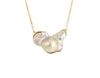 Large free form pearl set in yellow gold and yellow gold chain.