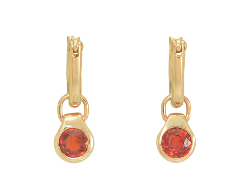 Round drops with bright orange gems in rose gold frame. Drops hang on small U shaped hoops in solid rose gold.