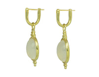 Oval drops with white moonstone cabochon gem in green gold frame. Drops hang on small U shaped hoops in solid green gold.