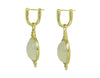 Oval drops with white moonstone cabochon gem in green gold frame. Drops hang on small U shaped hoops in solid green gold.