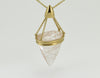 Very large pear shaped gem clear white with golden threads, intricate gold cap and chain.