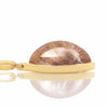 Long clear gem pointed at both ends with golden threads in the gem set in yellow gold pendant.