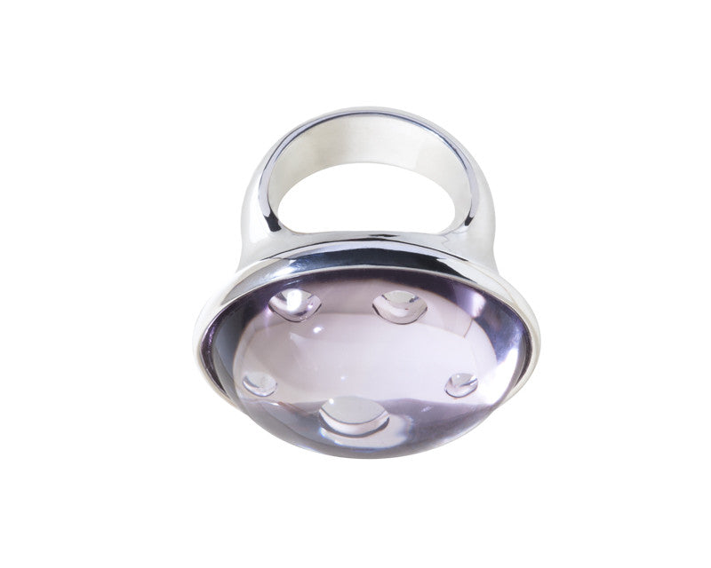 Very large silver ring with large round light purple gem.