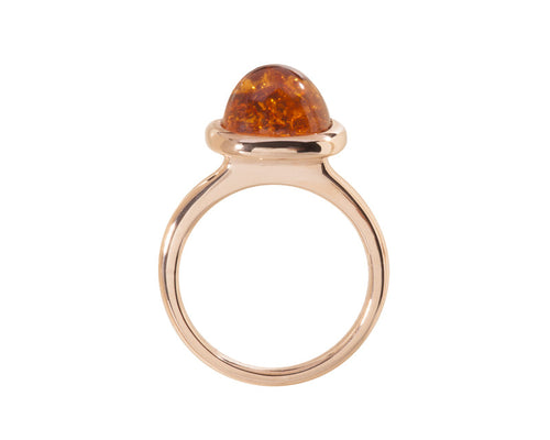 Medium size cushion cabochon of bright orange spessartite garnet frame set in rose gold ring.