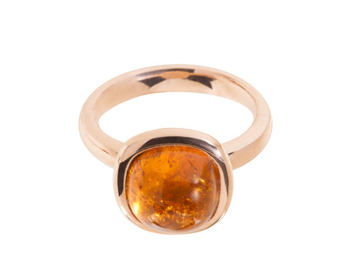 Medium size cushion cabochon of bright orange spessartite garnet frame set in rose gold ring.