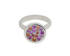 White gold ring set with scattering of pink and orange gems in round face.