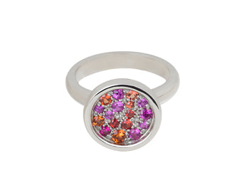 White gold ring, round face, small pink, orange, reddish gems scattered in the face.