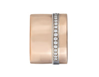 Very wide rose gold band with a long row of diamonds close to one edge of the band.
