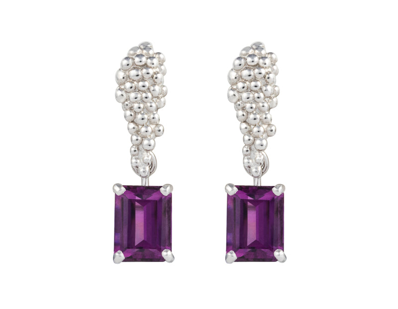 Pair of platinum studs in the shape of a bunch of grapes carved in detail in relief. Hanging from the bottom are a pair of rich purple rectangular rhodolite garnets.
