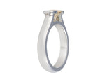 Platinum ring with natural pastel yellow sapphire. The sapphire is oval and lies across the finger and is bezel set at two ends.