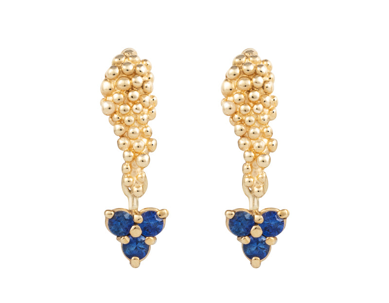 Pair of platinum studs in the shape of a bunch of grapes carved in detail in relief. Hanging from the bottom are trios of round blue sapphires forming a triangle.
