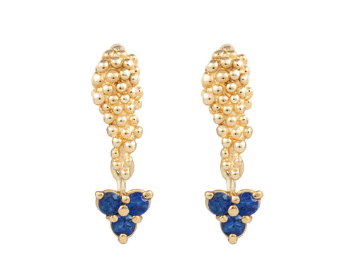 Pair of platinum studs in the shape of a bunch of grapes carved in detail in relief. Hanging from the bottom are trios of round blue sapphires forming a triangle.