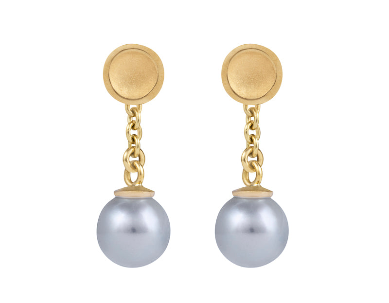 Small silver-blue pearls with yellow gold cap and chain dangling from yellow gold stud.