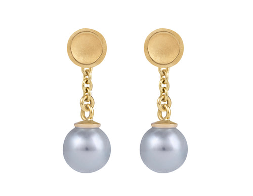 Small silver-blue pearls with yellow gold cap and chain dangling from yellow gold stud.