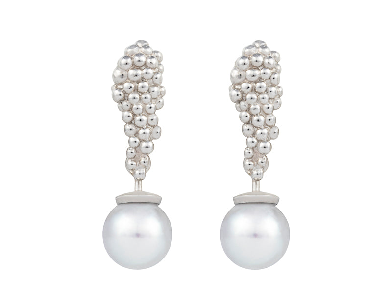 Pair of platinum studs in the shape of a bunch of grapes carved in detail in relief. Hanging from the bottom are silver blue pearls with a platinum cap.