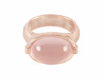 Oval rose quartz cabochon in 18k rose gold ring.