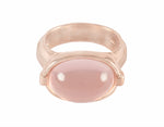 Oval rose quartz cabochon in 18k rose gold ring.