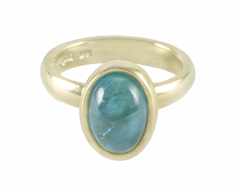 Aquamarine cabochon in 18k green gold ring.