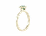 Blue-green tourmaline in 18k green gold ring.