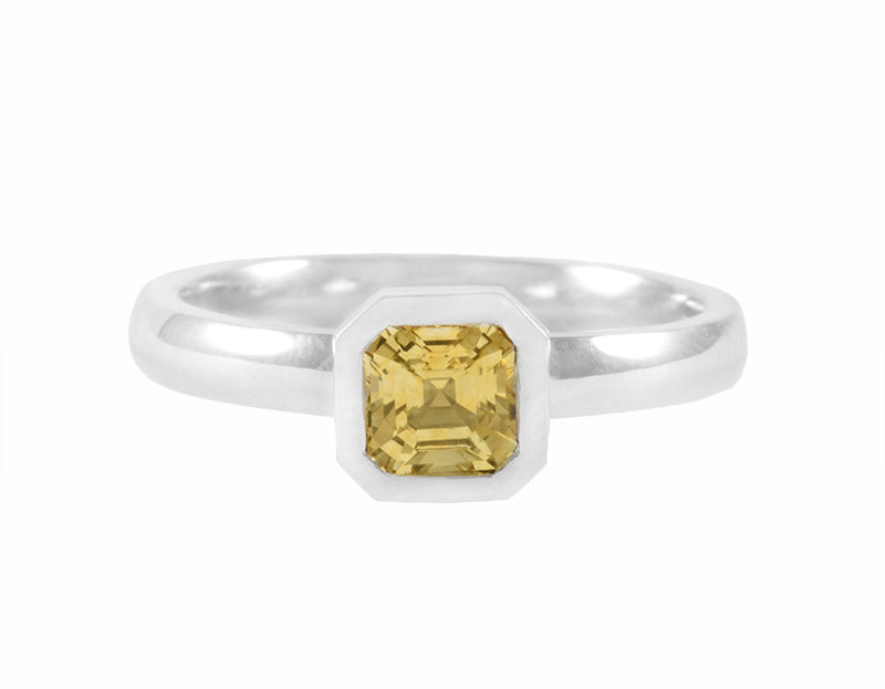 Yellow sapphire in platinum ring.