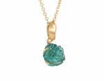 Carved indicolite tourmaline rose as pendant 18k yellow gold.