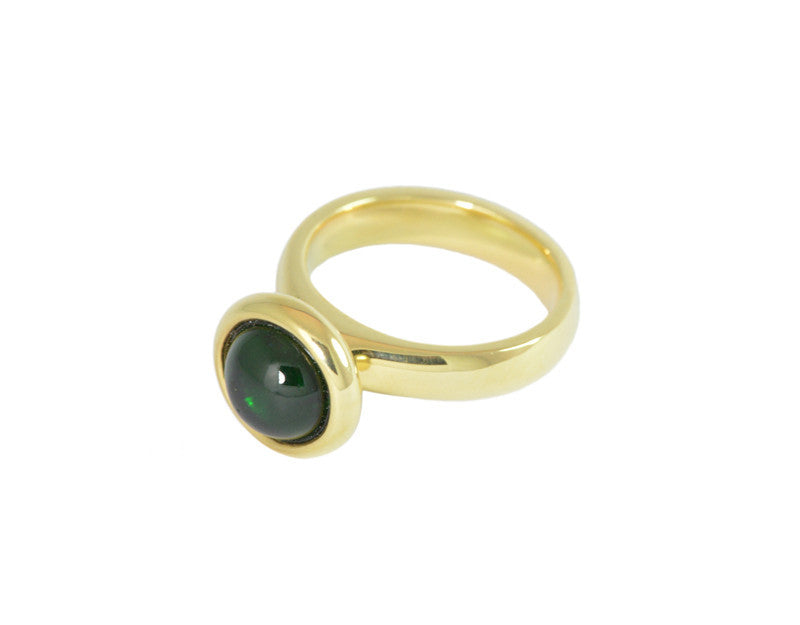 Medium size round cabochon of bright green tourmaline frame set in yellow gold ring.