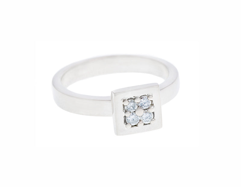 White gold ring, square face, set with four matching diamonds.