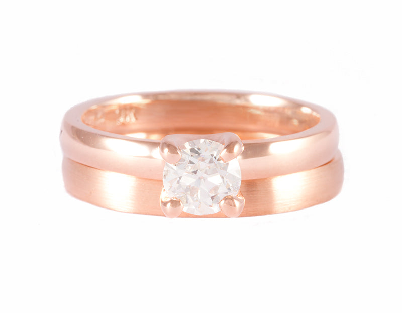Diamond ring, four prongs, rose gold, and rose gold matching band.