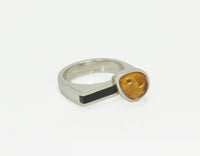 Amber and onyx ring in platinum.