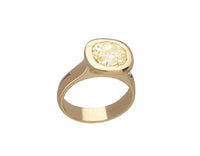 Large yellow diamond in yellow gold ring.