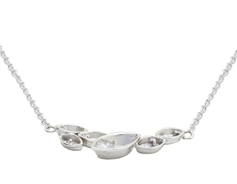 White gold pendant, leaf motif, with diamonds.