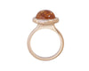 Rose gold ring with bright orange spessartite garnet cabochon gem.