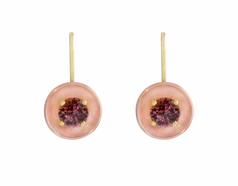 Drop earrings with yellow gold wires and rose gold bowls. Bright brandy coloured faceted gems prong set in each bowl.