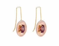 Drop earrings with yellow gold wires and rose gold bowls. Bright brandy coloured faceted gems prong set in each bowl.