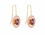 Drop earrings with yellow gold wires and rose gold bowls. Bright brandy coloured faceted gems prong set in each bowl.