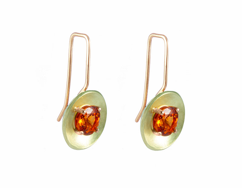 Drop earrings with rose gold wires and green gold bowls. Bright orange faceted gems prong set in each bowl.