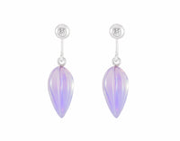 Pale purple carved gems hanging from platinum diamond studs.