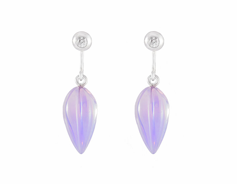 Pale purple carved gems hanging from platinum diamond studs.
