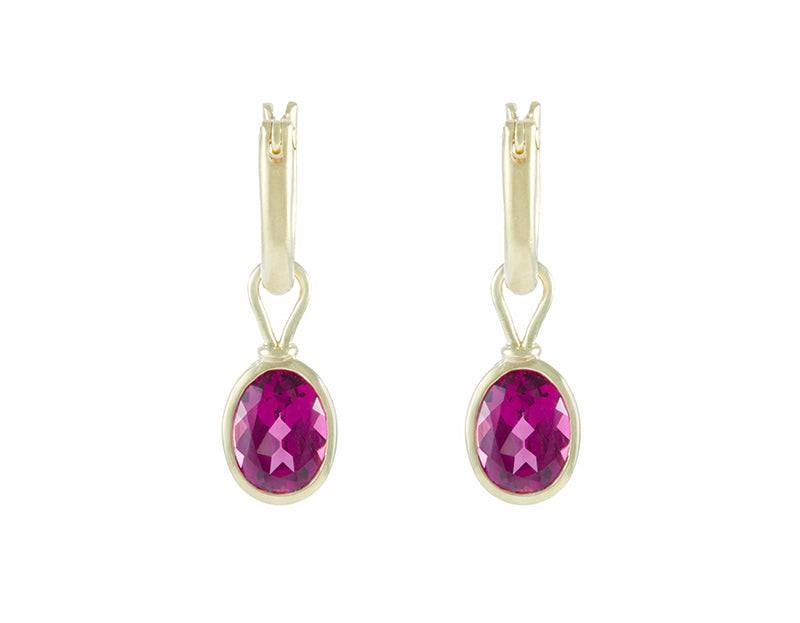 Green gold hoop earrings with green gold drops and bright raspberry pink oval gems.