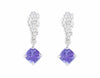 Studs in platinum like a bunch of grapes. Blue-purple tanzanite gems hanging from the ends. 