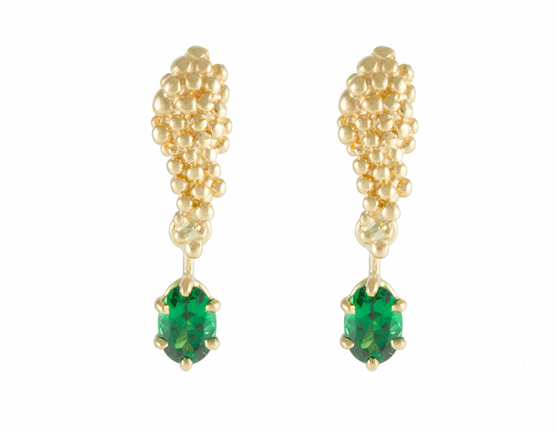 Studs in yellow gold like a bunch of grapes. Green oval gems hanging from the ends. 