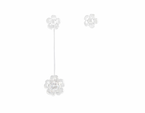Pair of white gold flower studs, one stud has larger flower hanging from it in white gold with large diamond.